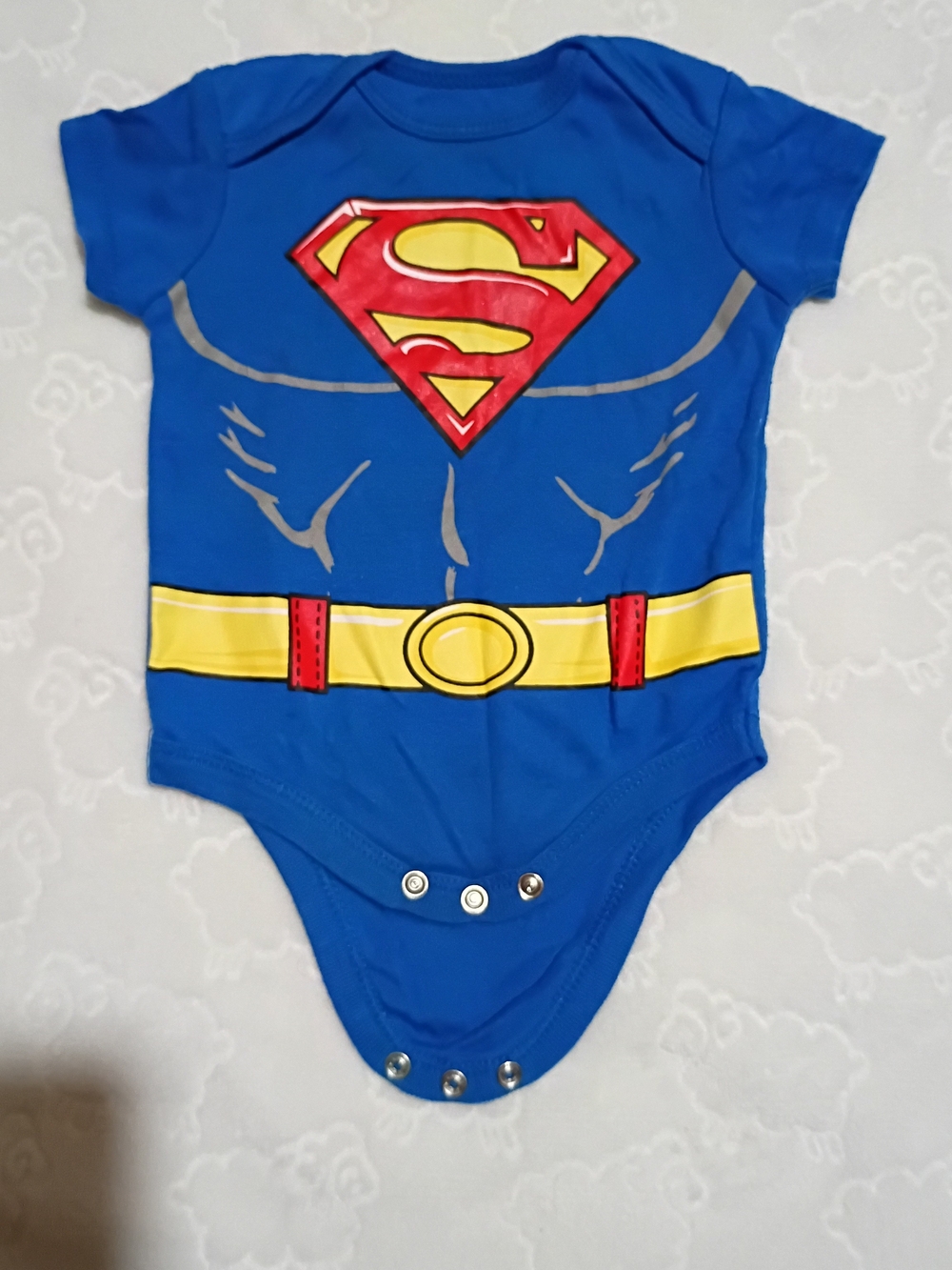 & Other Stories Blue Superman-Inspired Baby Onesie with Red & Yellow Emblem